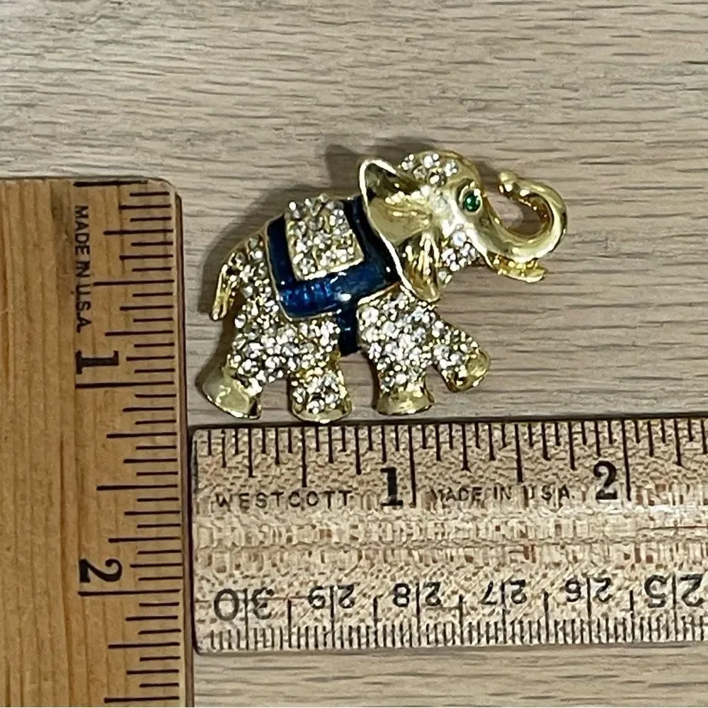 Elephant Rhinestones Brooch Gold Tone Green Gem Eye Blue Enamel Saddle Trunk Up